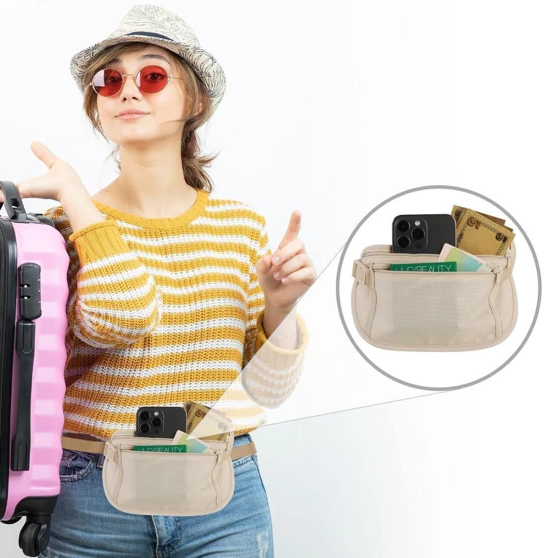 Traveller with a suitcase wearing the waist pouch, holding a phone and cards
