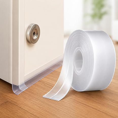 Clear self-adhesive seal strip fitted along the bottom edge of a white door