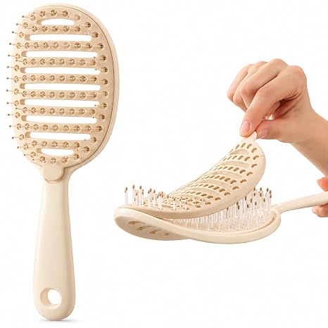 Beige vented detangling hair brush with its inner cleaning pad being lifted out